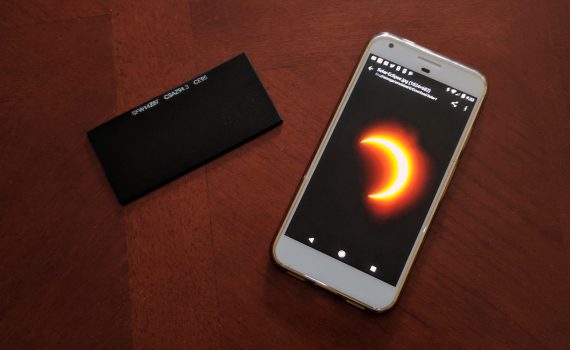 Place eclipse glasses or welder's glass over a cell phone to photograph a solar eclipse.