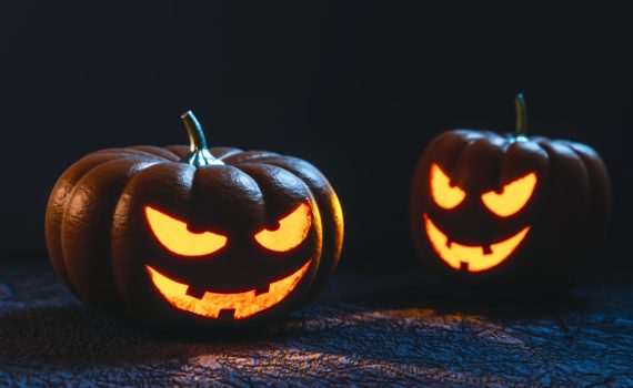 The self-carving pumpkin demonstration involves carving a jack-o-lantern face using an explosive chemical reaction.
