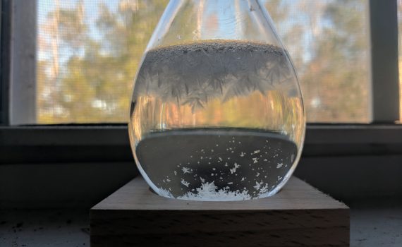 The crystals in a storm glass change, depending on temperature and other weather conditions.