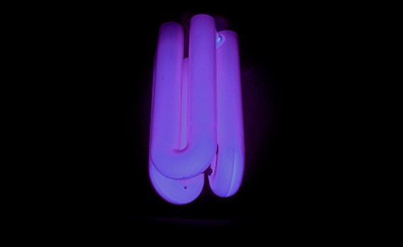 Black light emits is ultraviolet radiation, which is invisible or "black."